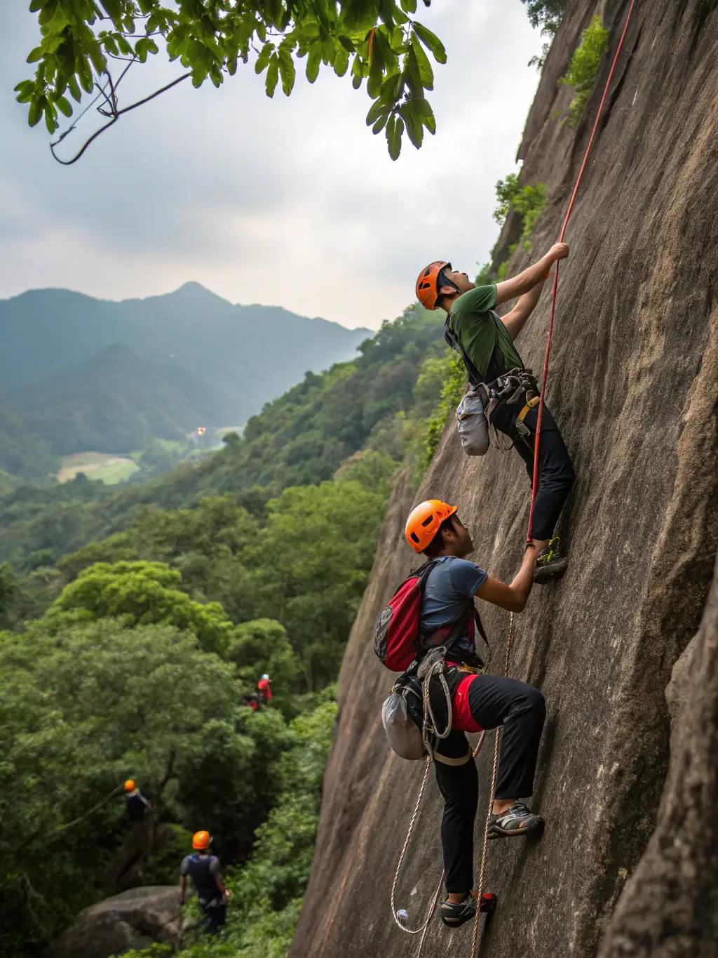 Participants working together to set up a climbing route, demonstrating problem-solving skills and collaboration in a supportive environment.