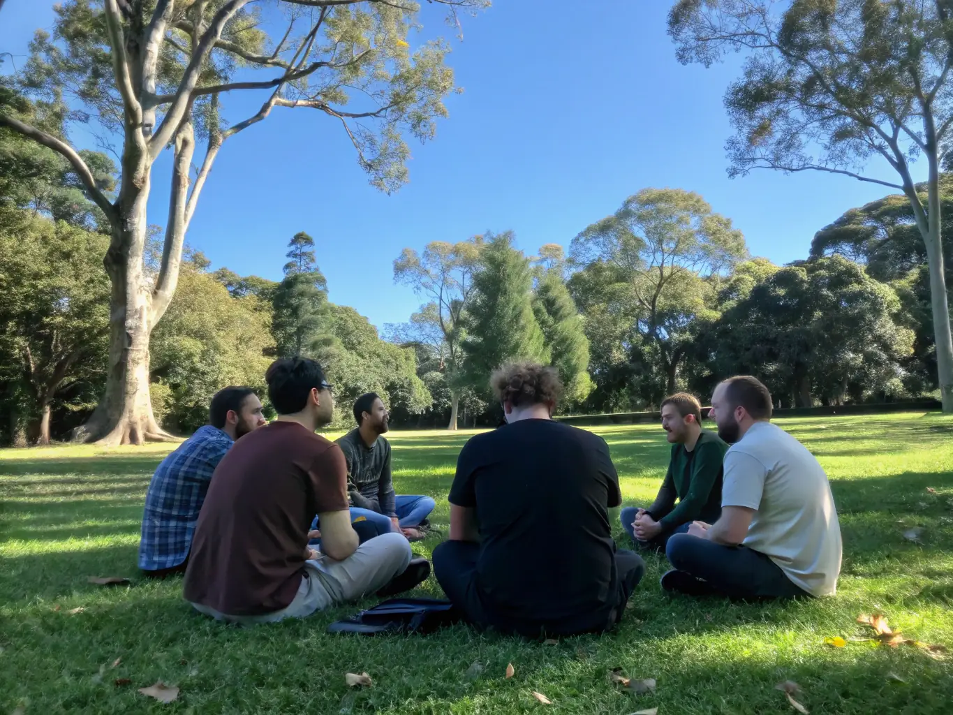 A diverse group of participants collaborating on a team-building exercise in a natural environment, highlighting the importance of teamwork and community engagement.